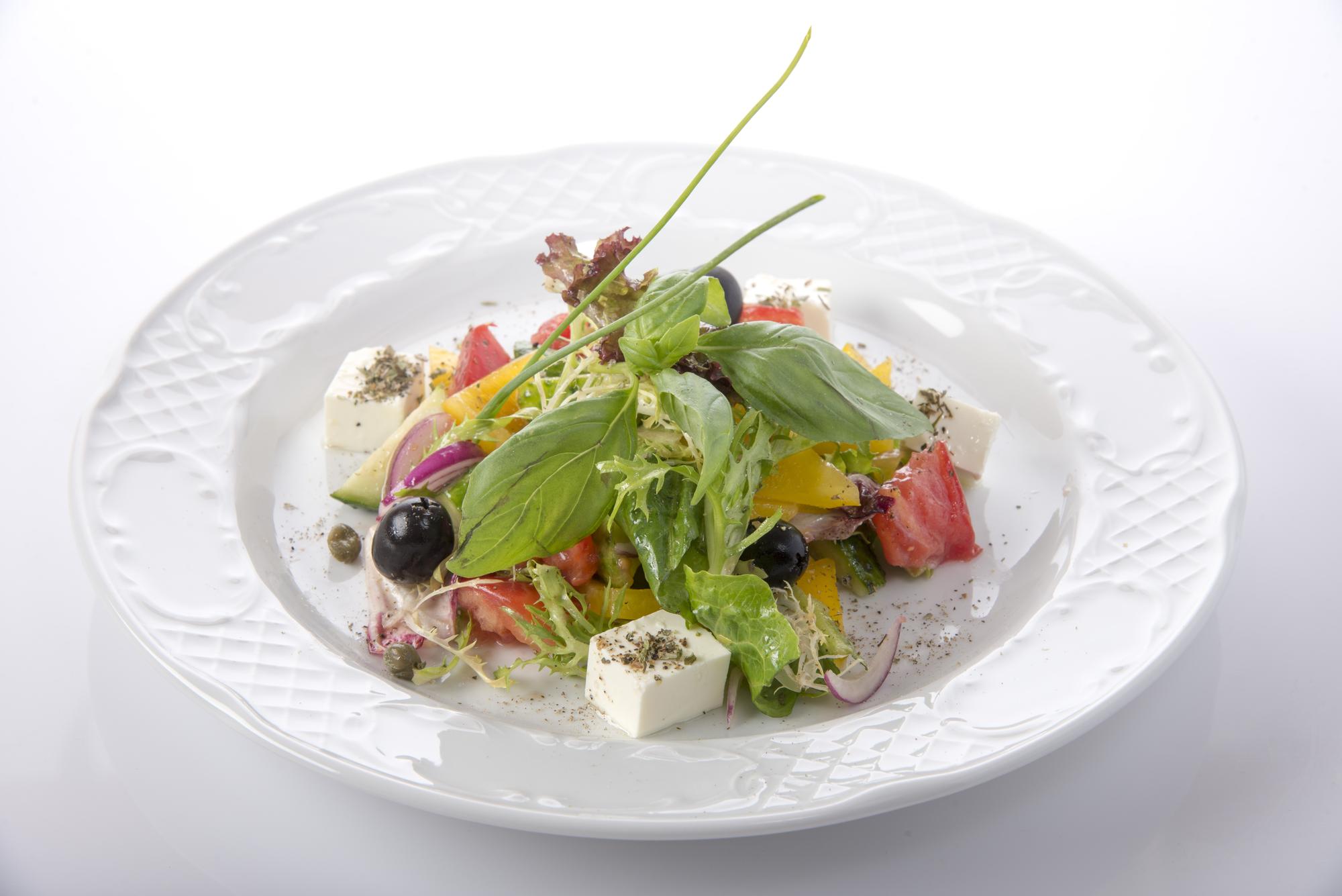 Plated seasonal salad on ceramic plate